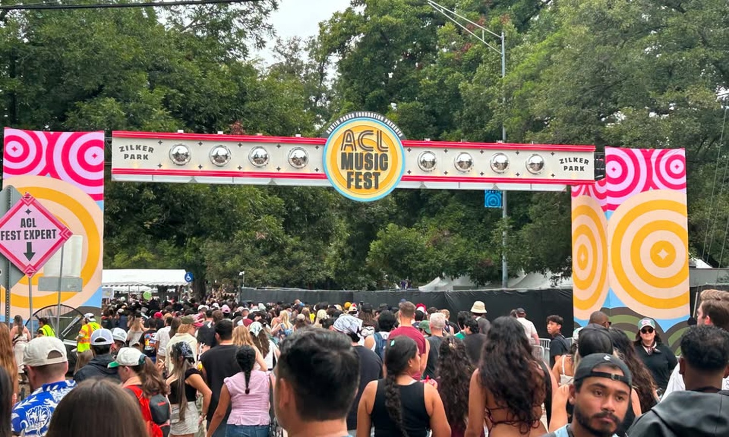 Walking in under the ACL Music Fest gate on Barton Springs Road.