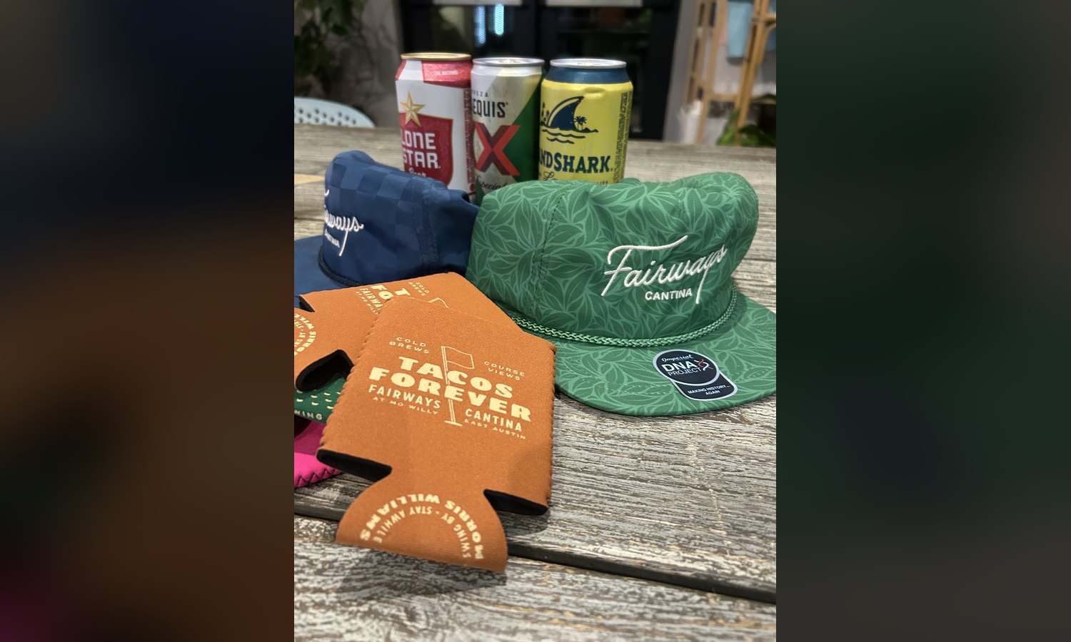 Rope hats and koozies at the counter. "Swing by, stay awhile" is doing a lot of work there.
