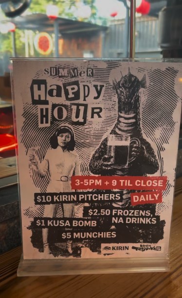 The summer happy hour card sitting on the bar at E 6th
